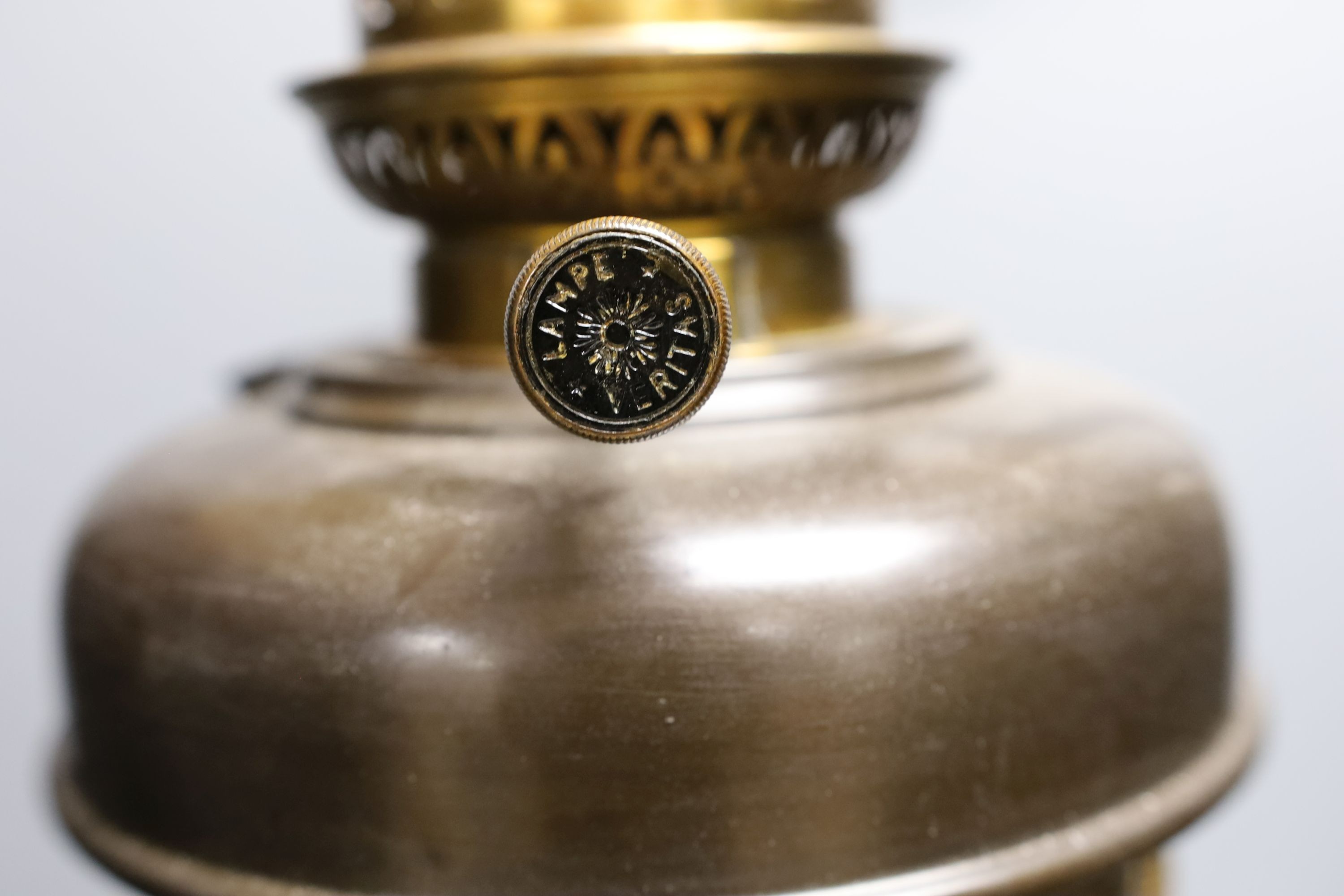 A gilt metal ‘rams head and hoof’ monopodia oil lamp, converted to electric, total height 72cm